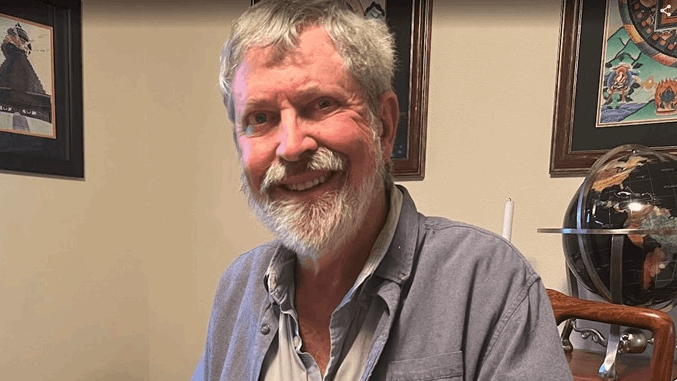 Harry Haigler sitting at a table. Harry Haigler sitting at a table.