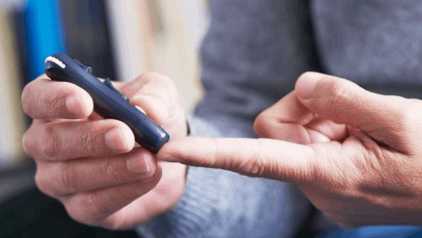 A person checking their glucose level