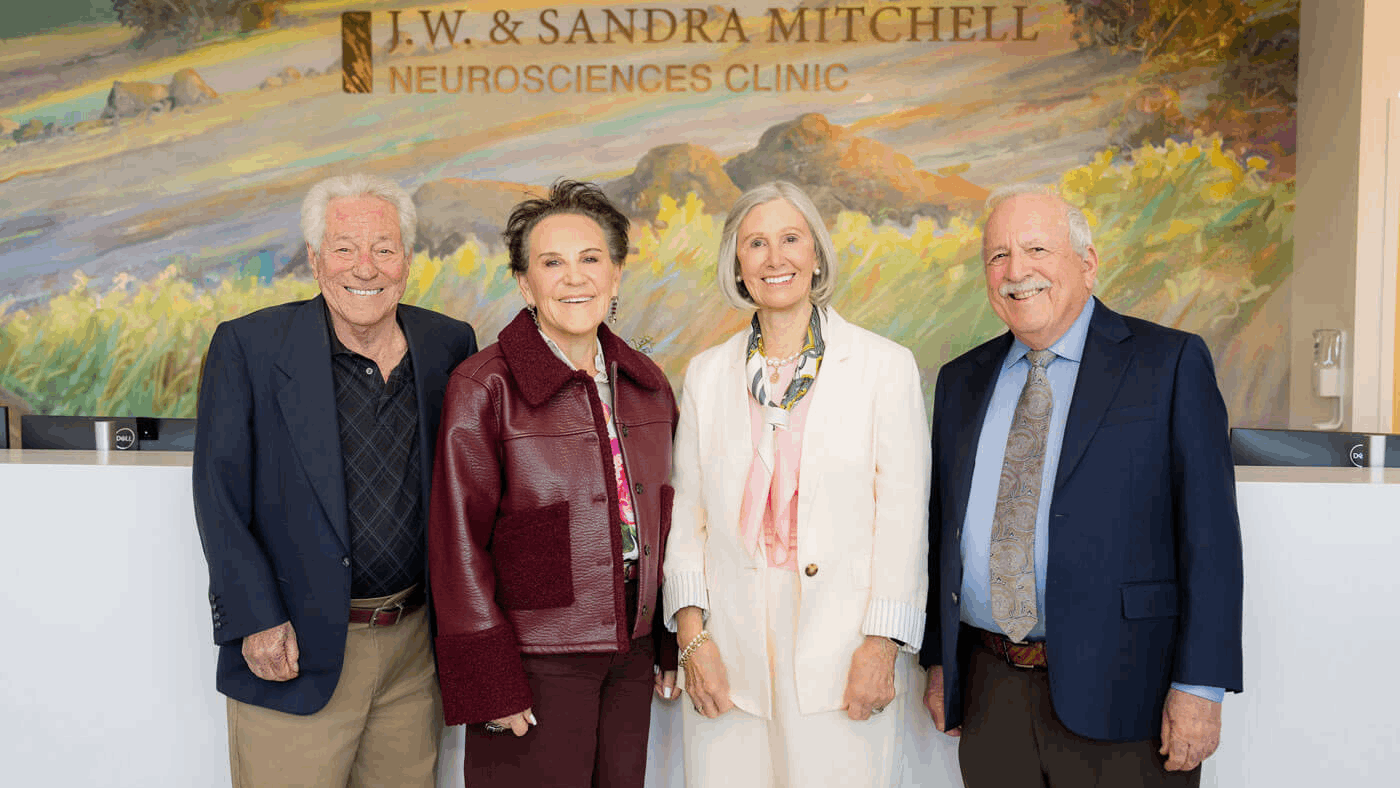 Richard Goodman, Cecilia Goodman, Susan Laird and Howard Schulman stand in front of the J.W. & Sandra Mitchell Neurosciences Clinic.