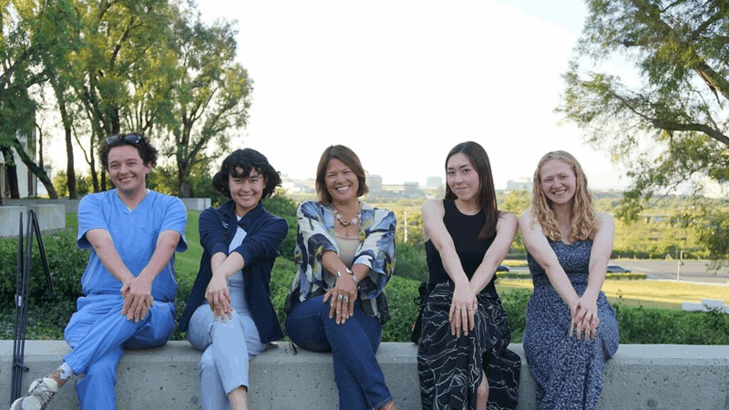 Students of the Medical Humanities and Arts Program with the program director outside