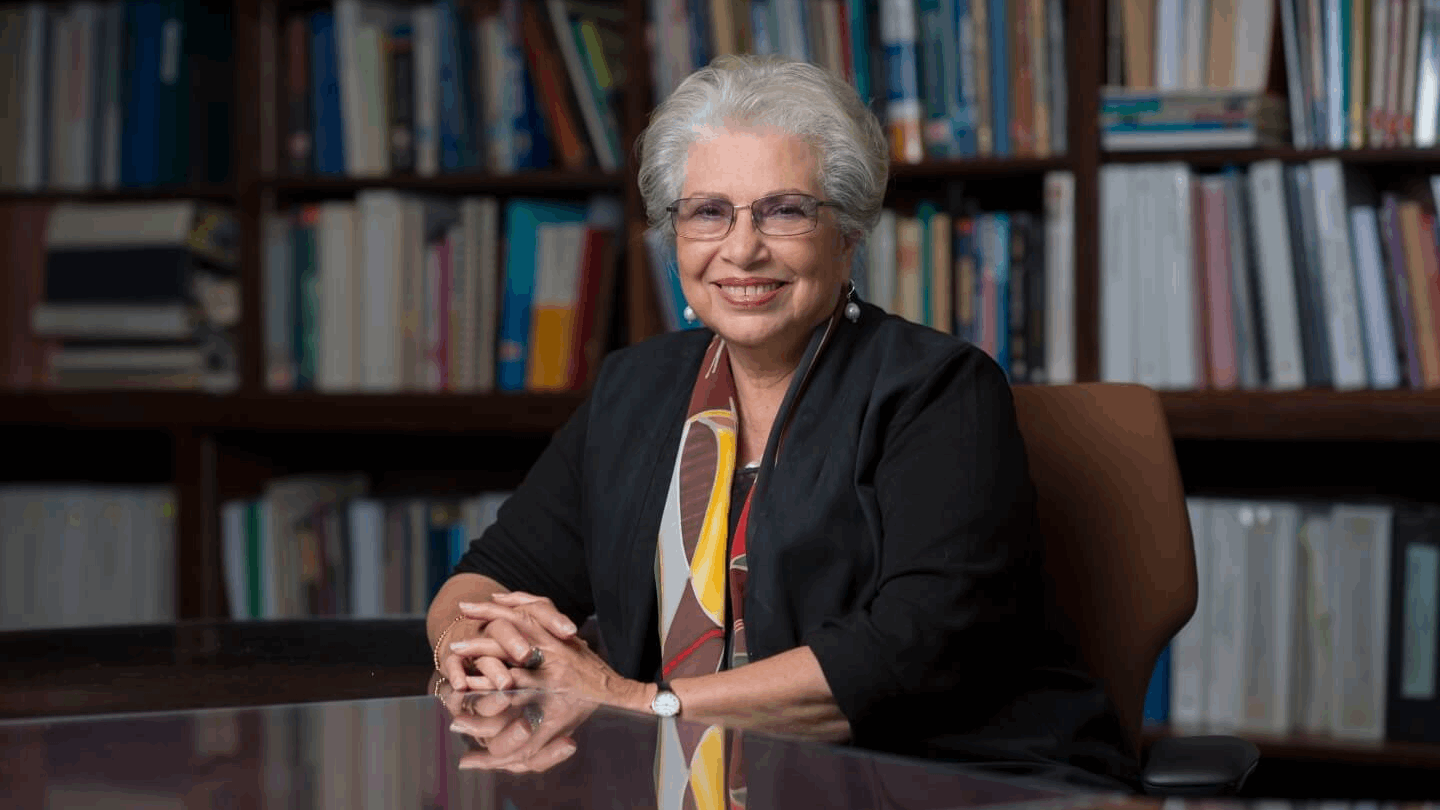 Dr. Hoda Anton-Culver seated at a desk